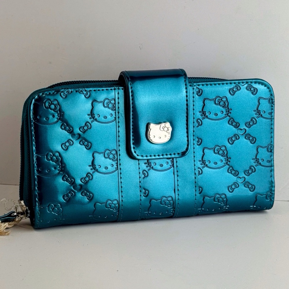 NWT Loungefly Teal Embossed zippered Hello Kitty Wallet